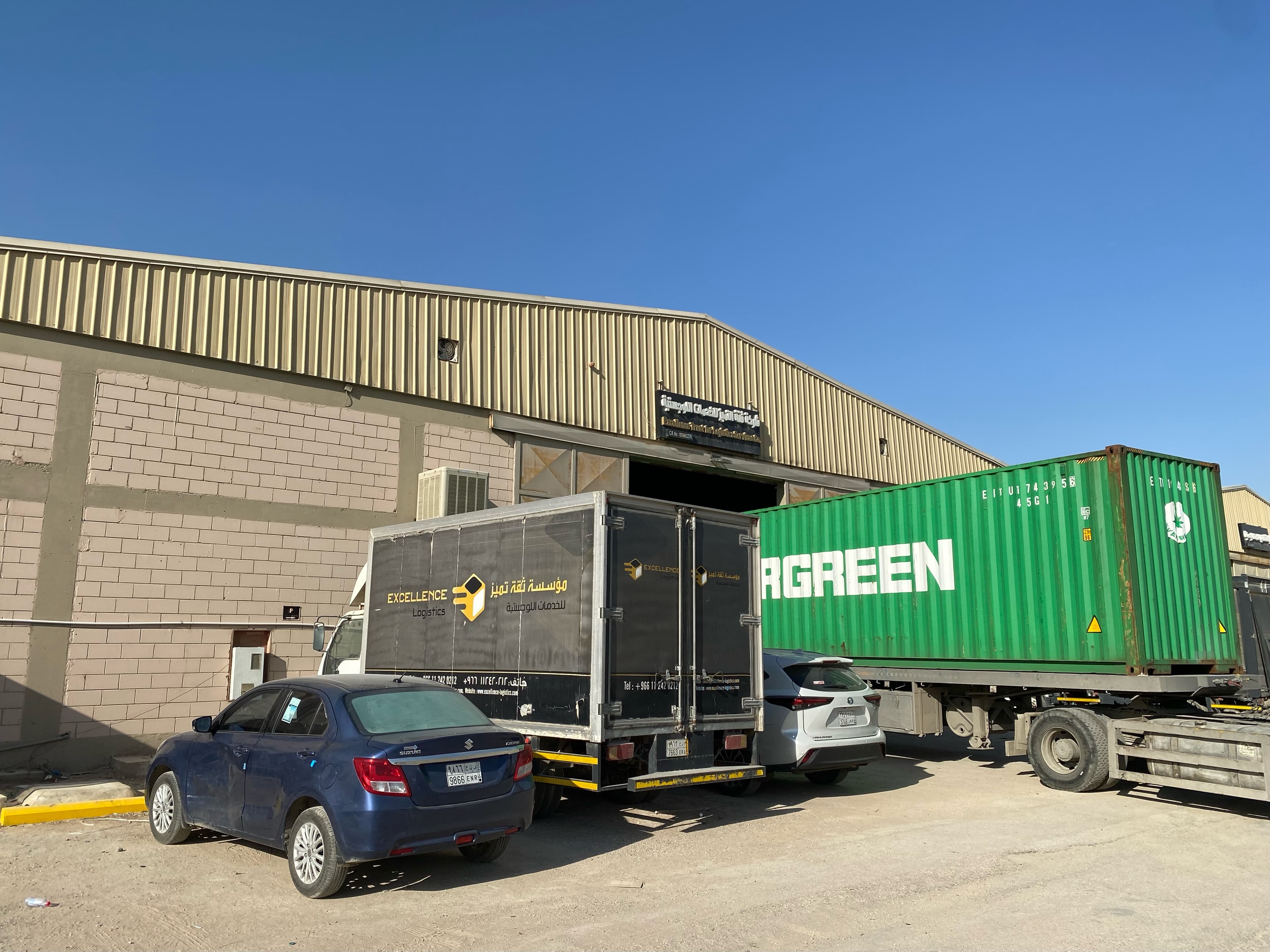 Excellence Logistics warehouse exterior with container truck